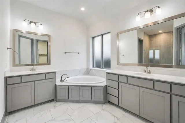 an empty room with a fireplace and windows