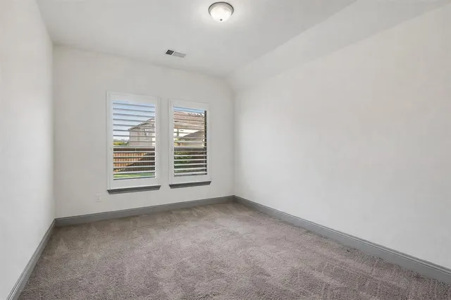 a bathroom with a shower sink and mirror