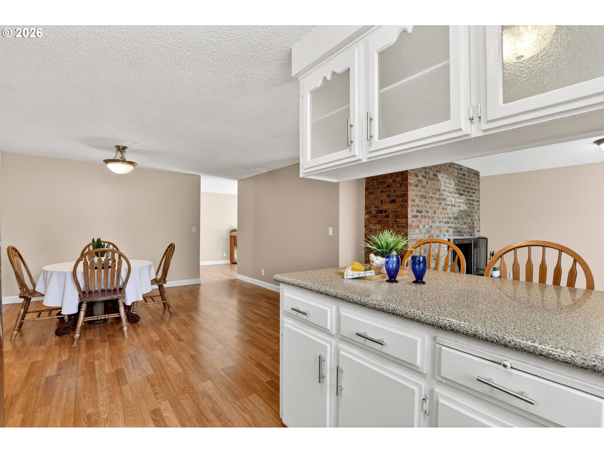640 Stonehill Street Gladstone, OR 97027 - Photo 17 of 48 a kitchen with a table chairs and a dining table view