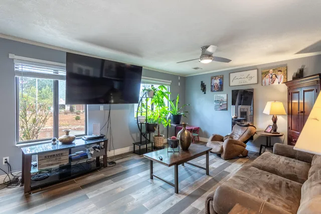 a view of a dining room with furniture and chandelier