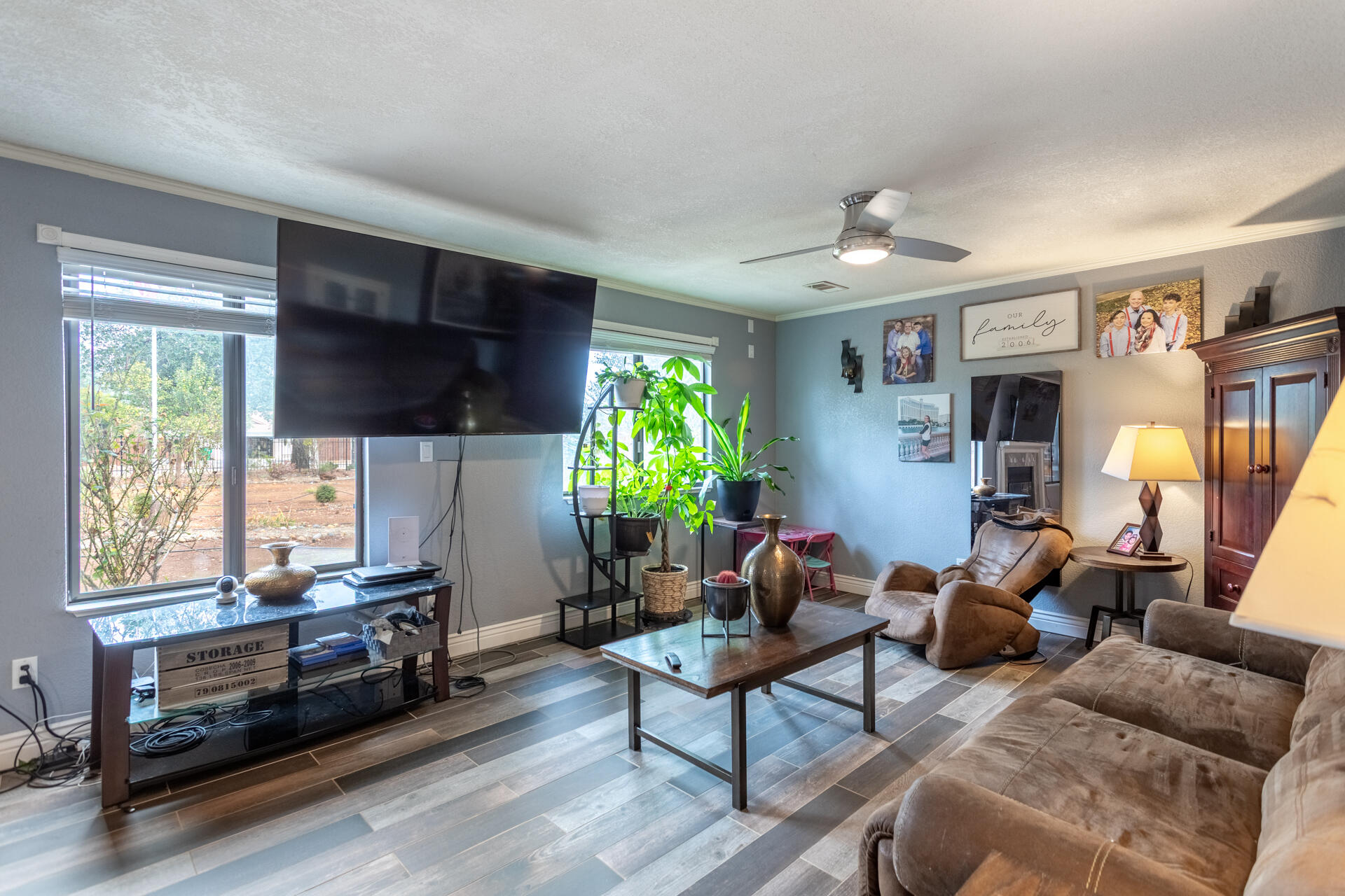 6188 Happy Valley Road Anderson, CA 96007 - Photo 17 of 58 a living room with furniture a window and a flat screen tv