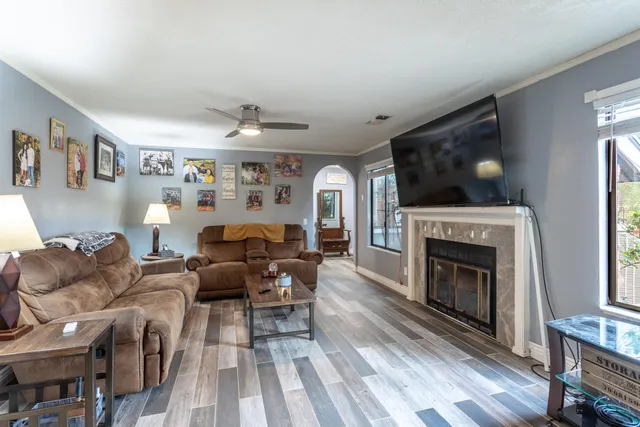 a dining room with furniture window and wooden floor