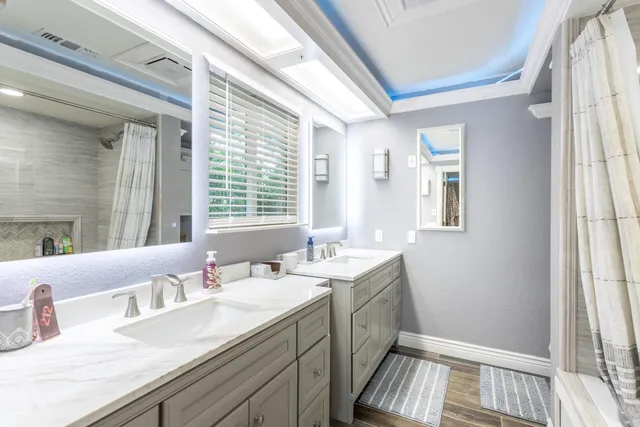 a bedroom with furniture and a flat screen tv