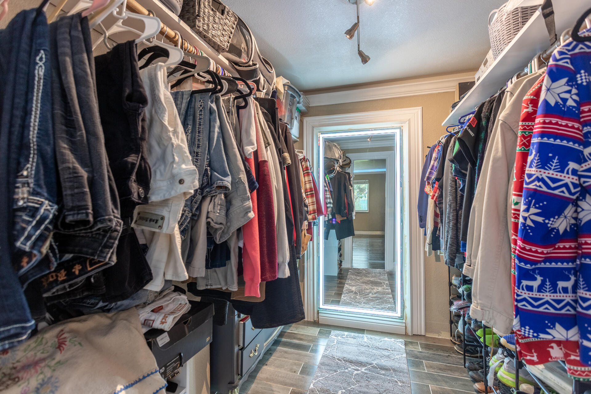 6188 Happy Valley Road Anderson, CA 96007 - Photo 35 of 58 a view of walk in closet with clothes and shoes