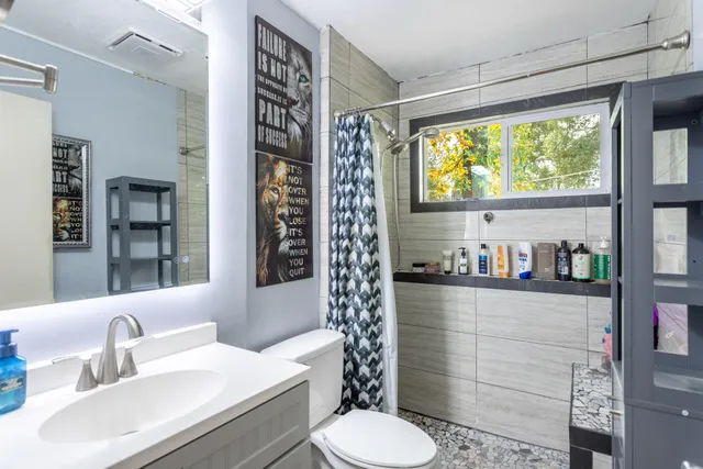a bathroom with a bathtub and a shower