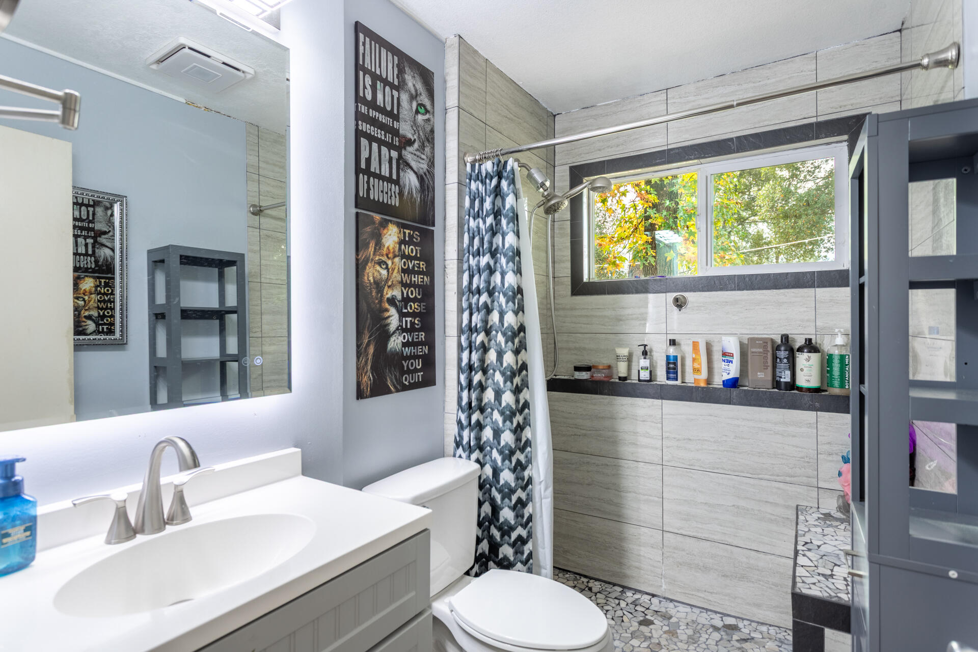 6188 Happy Valley Road Anderson, CA 96007 - Photo 37 of 58 a bathroom with a sink a toilet and shower