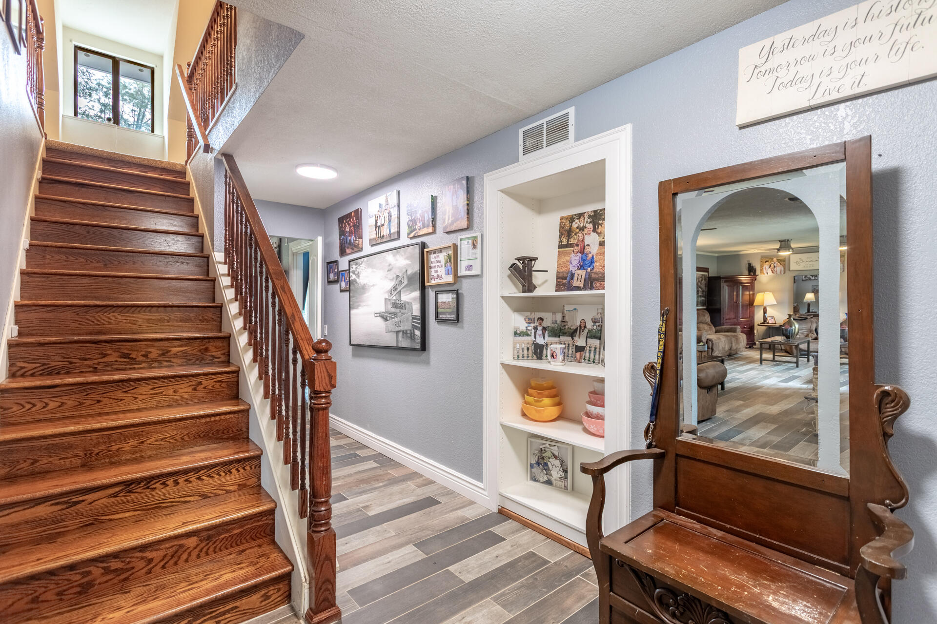 6188 Happy Valley Road Anderson, CA 96007 - Photo 40 of 58 a view of staircase with furniture and wooden floor