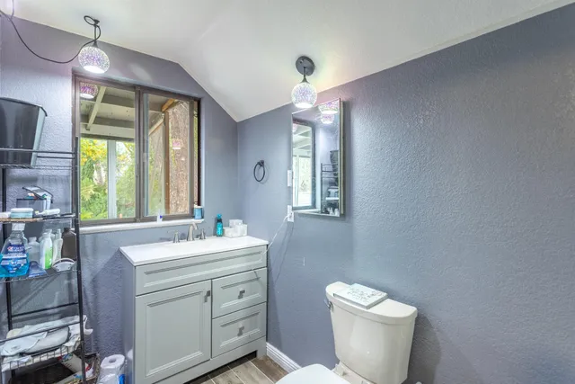 a view of a backyard with a fountain