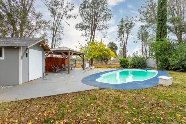 a view of swimming pool with a deck