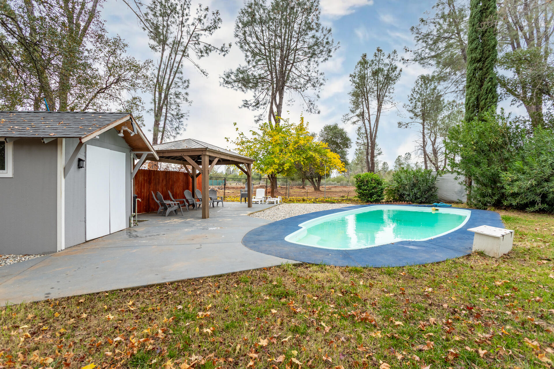 6188 Happy Valley Road Anderson, CA 96007 - Photo 49 of 58 a view of a backyard with a fountain