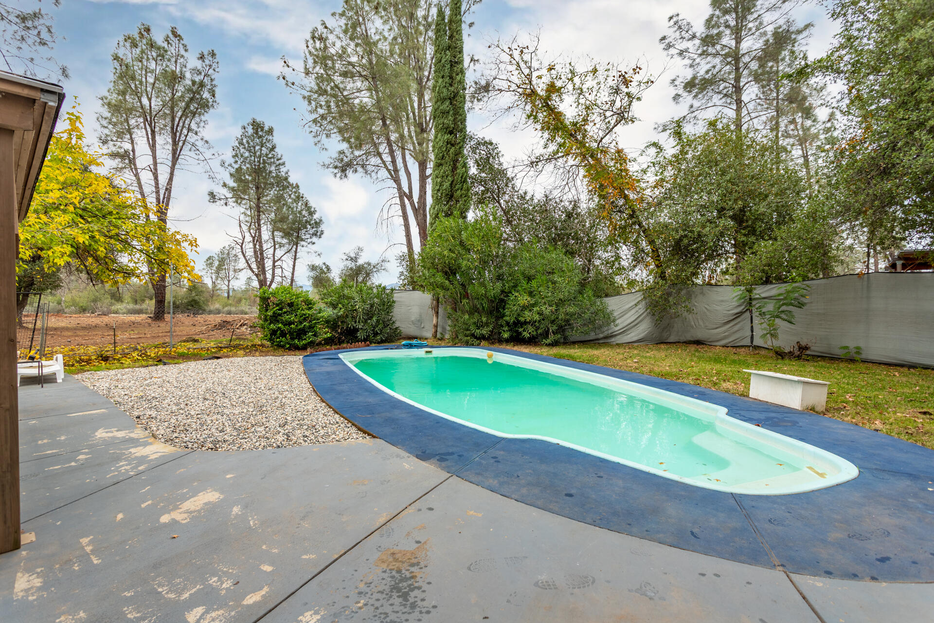 6188 Happy Valley Road Anderson, CA 96007 - Photo 50 of 58 a view of a swimming pool with an outdoor space