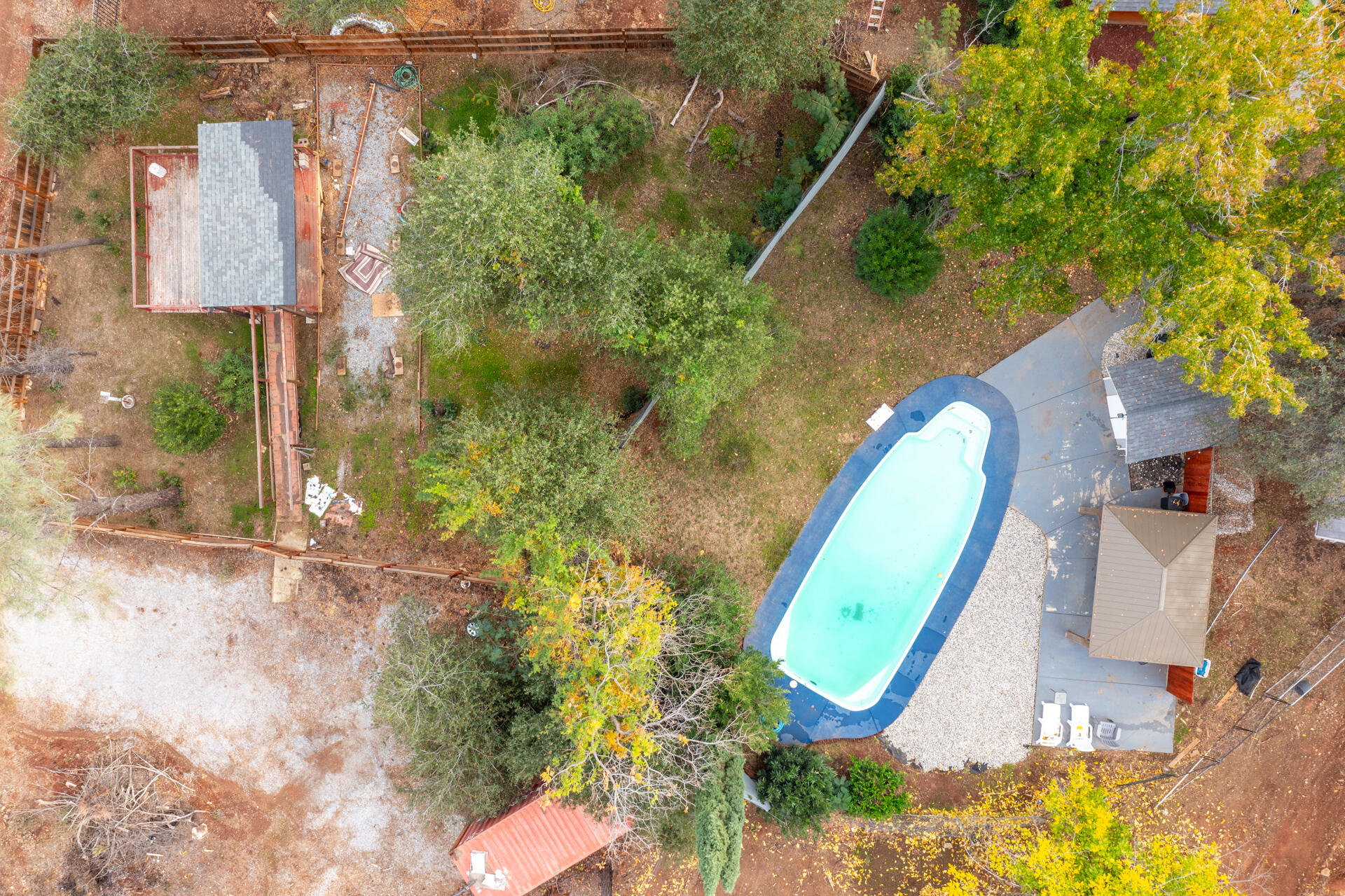 6188 Happy Valley Road Anderson, CA 96007 - Photo 54 of 58 a view of a backyard with a fountain plants and large tree