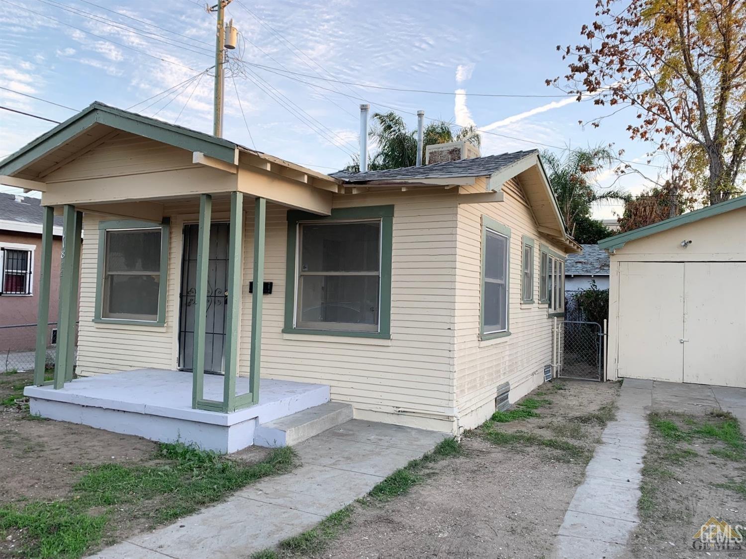 Undisclosed Address Bakersfield, CA 93304 - Photo 4 of 15 a front view of a house with garden