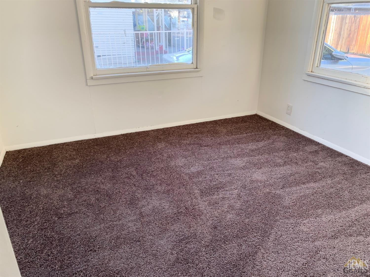 Undisclosed Address Bakersfield, CA 93304 - Photo 7 of 15 an empty room with a window