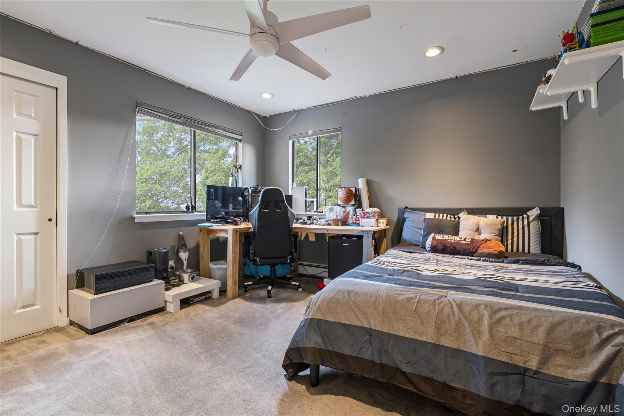 258 Half Hollow Road Dix Hills, NY 11746 - Photo 20 of 45 a bedroom with a bed and a chandelier