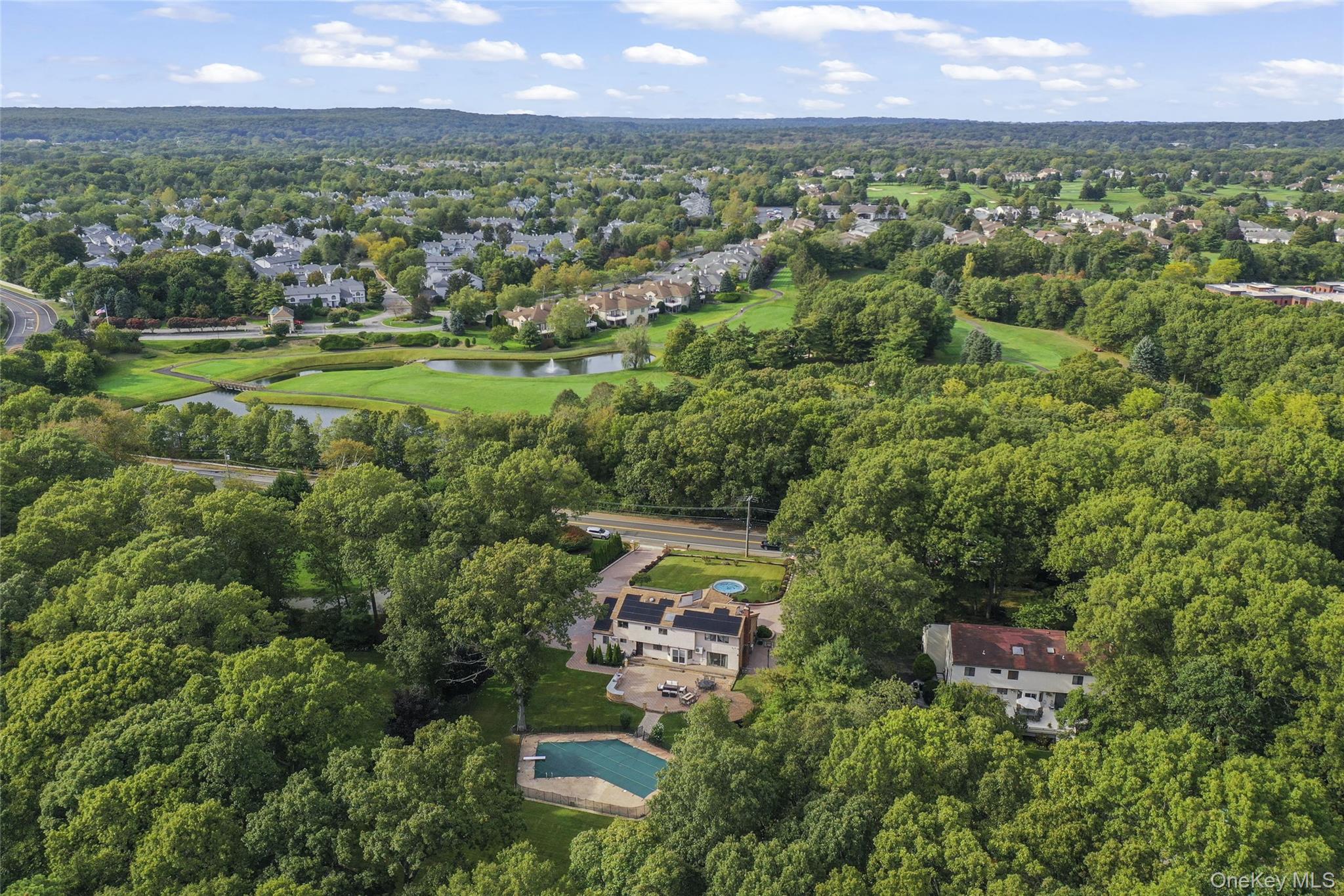 258 Half Hollow Road Dix Hills, NY 11746 - Photo 2 of 45 an aerial view of a city with lots of residential buildings
