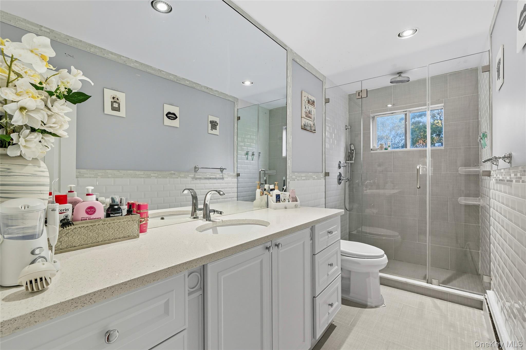 258 Half Hollow Road Dix Hills, NY 11746 - Photo 22 of 45 a bathroom with a sink a toilet and shower