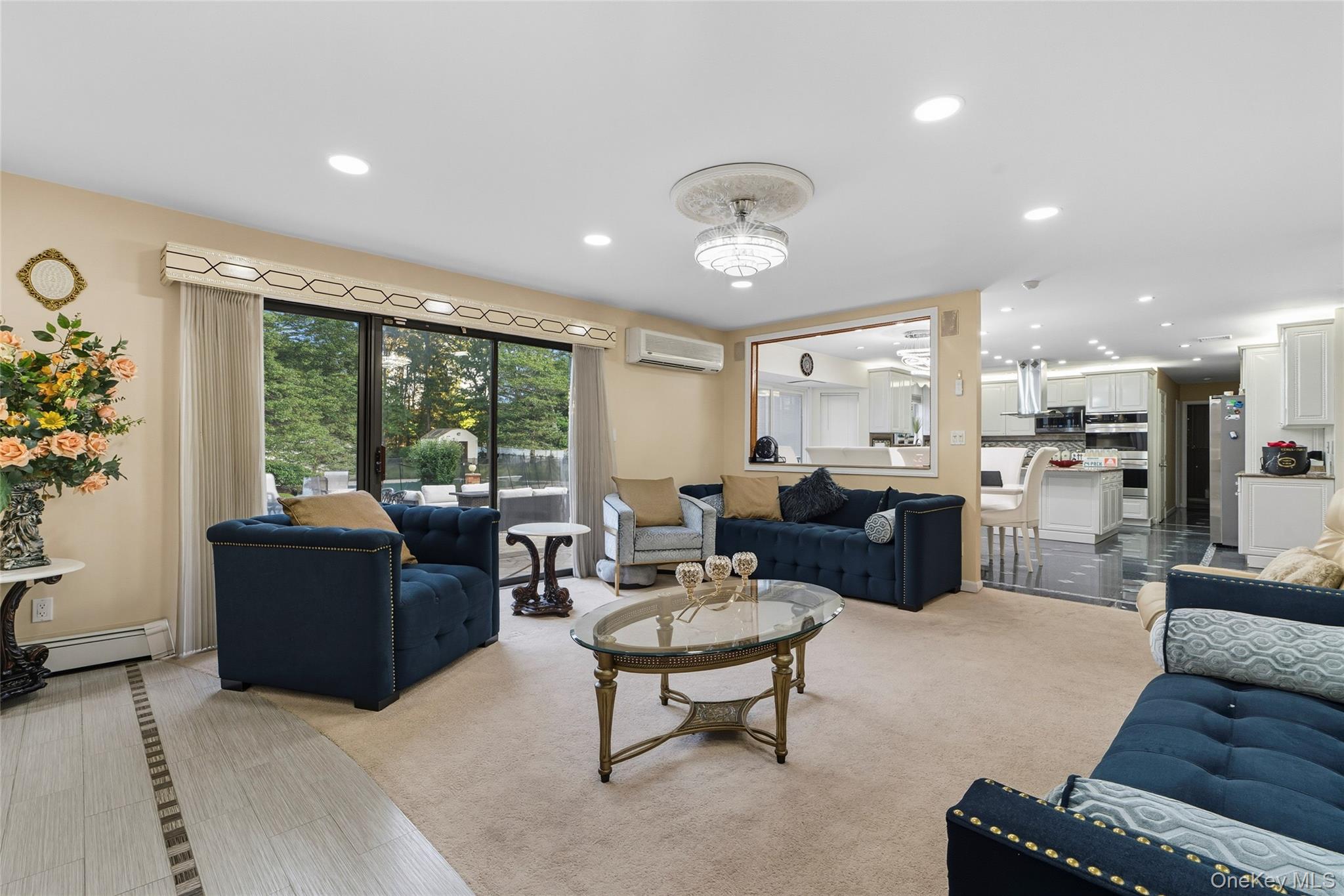 258 Half Hollow Road Dix Hills, NY 11746 - Photo 28 of 45 a living room with furniture and a large window