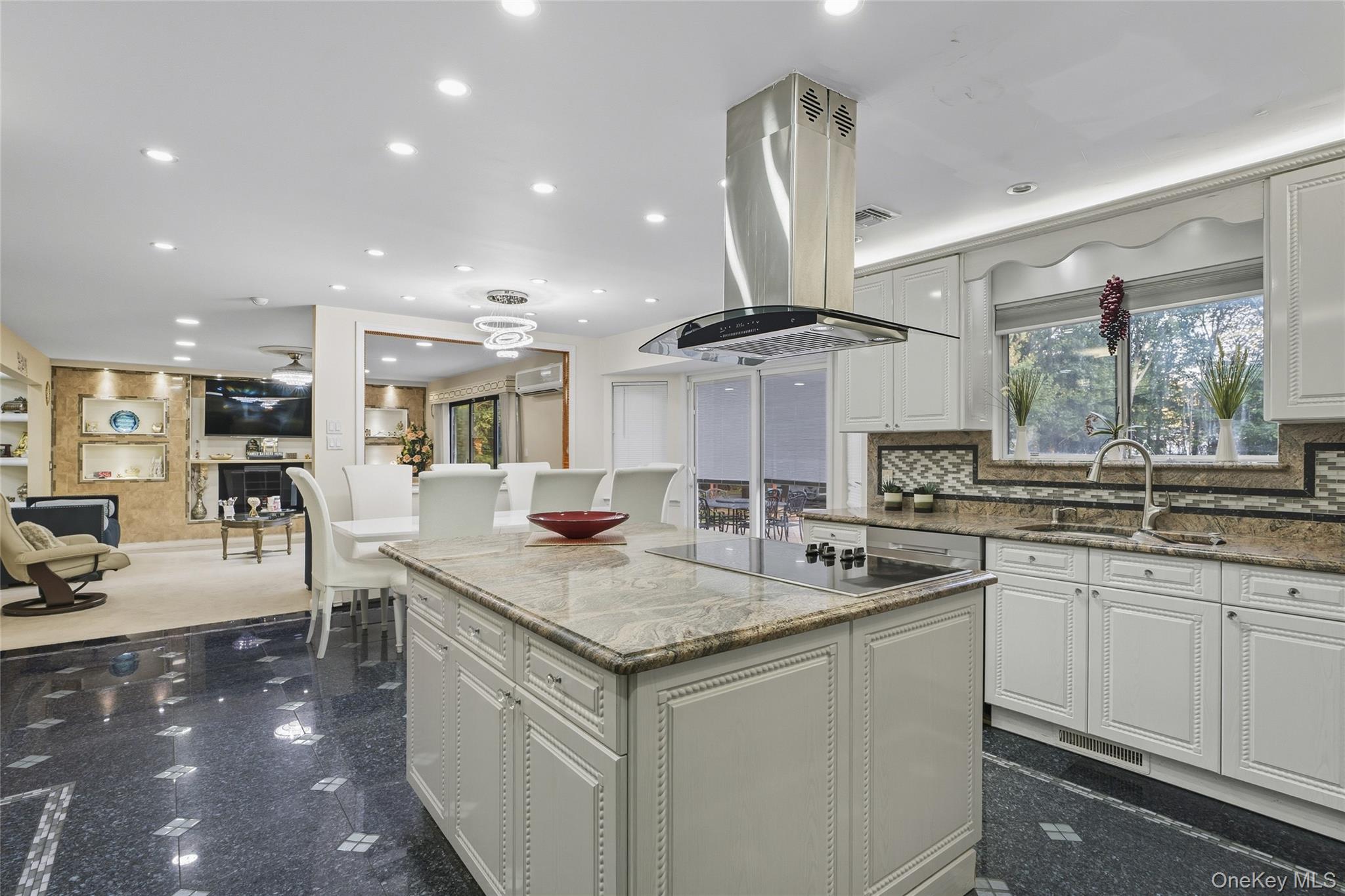 258 Half Hollow Road Dix Hills, NY 11746 - Photo 32 of 45 a kitchen with stainless steel appliances granite countertop a sink a stove a refrigerator and island
