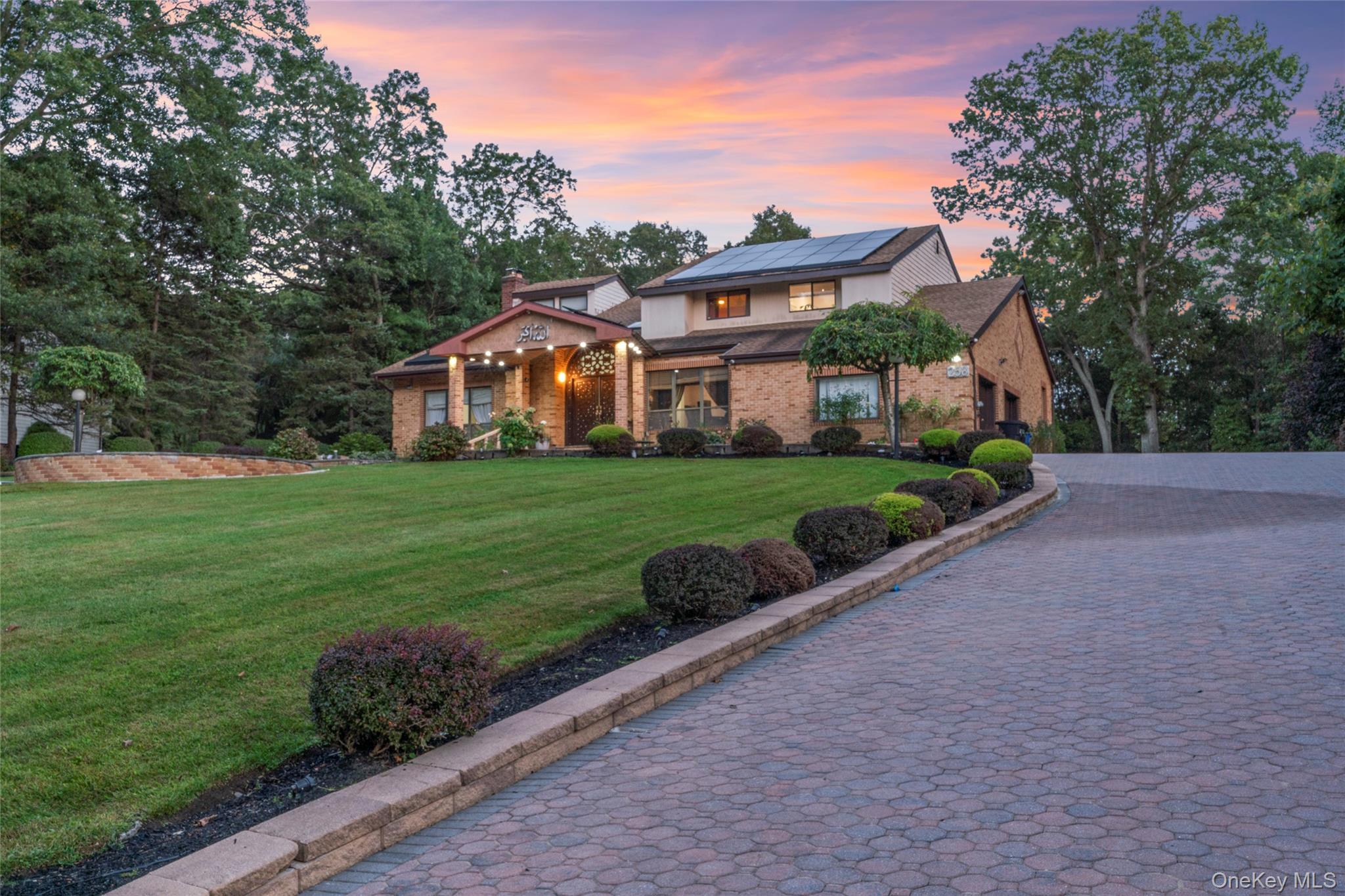 258 Half Hollow Road Dix Hills, NY 11746 - Photo 39 of 45 a front view of a house with garden