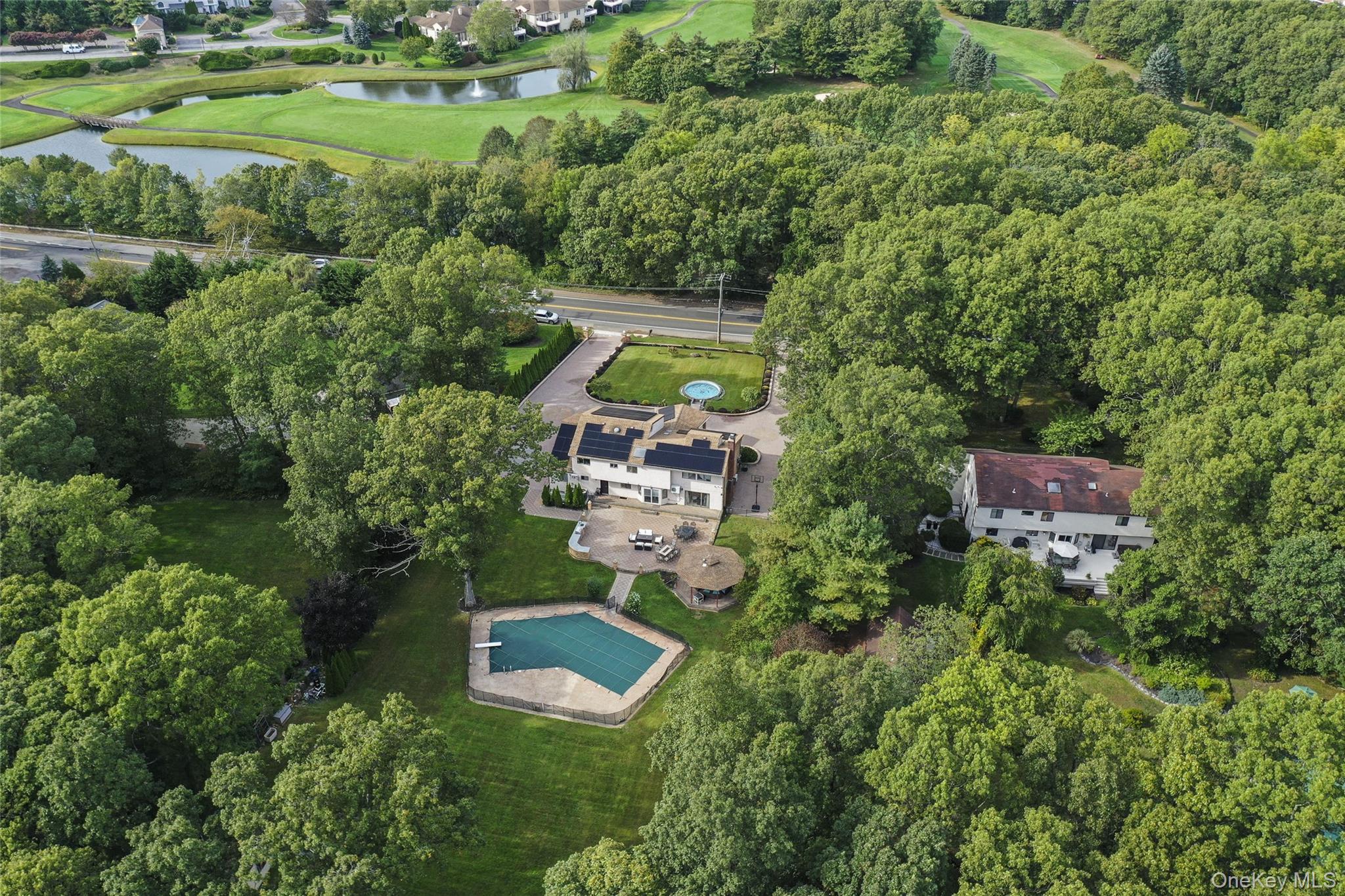 258 Half Hollow Road Dix Hills, NY 11746 - Photo 4 of 45 an aerial view of a house with a yard