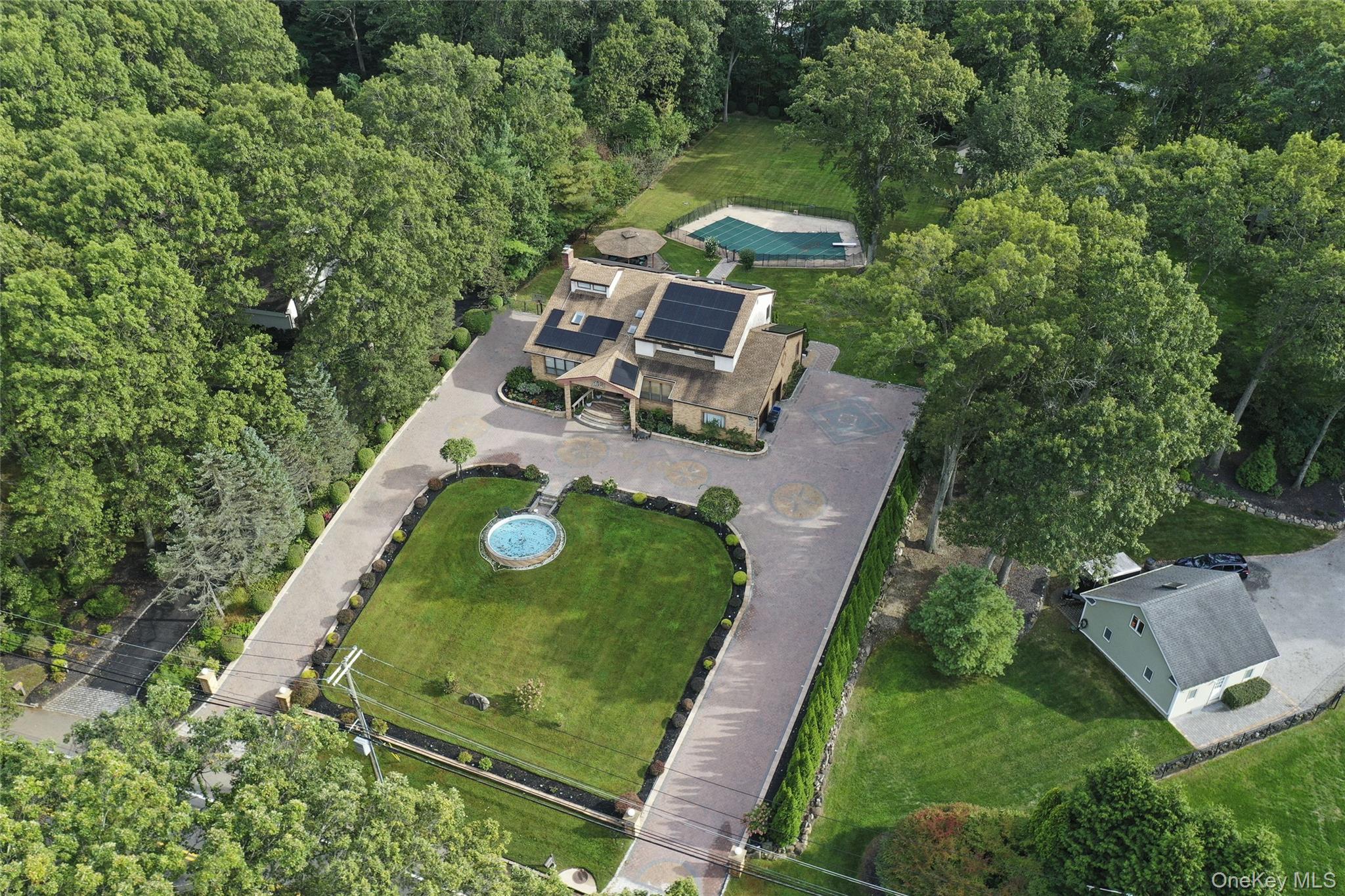 258 Half Hollow Road Dix Hills, NY 11746 - Photo 5 of 45 an aerial view of a backyard with chairs