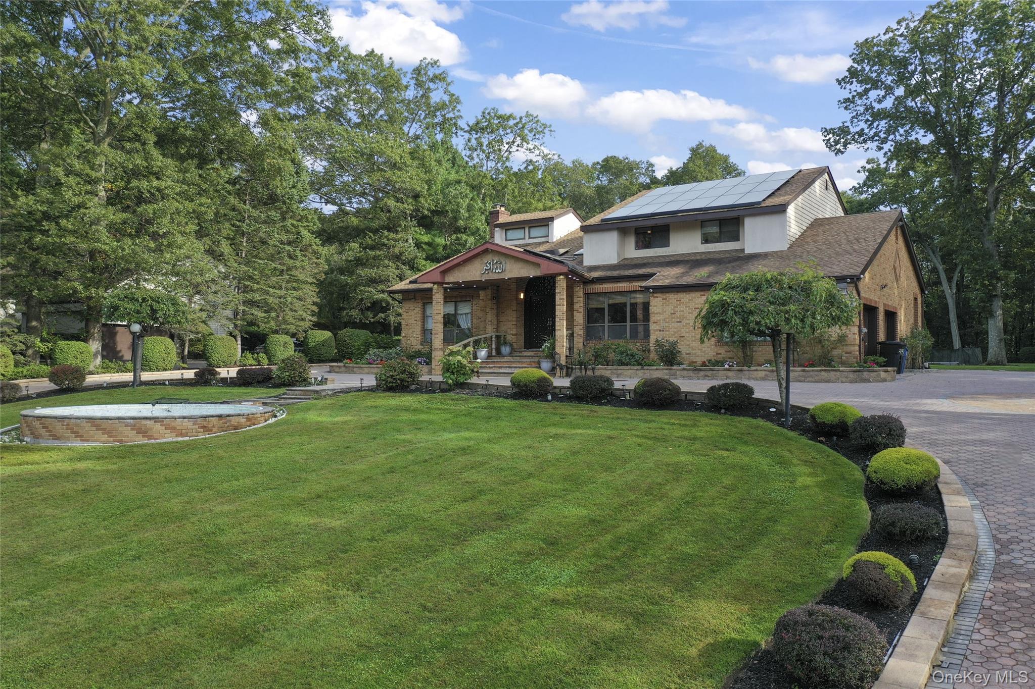 258 Half Hollow Road Dix Hills, NY 11746 - Photo 8 of 45 a front view of a house with a yard table and chairs