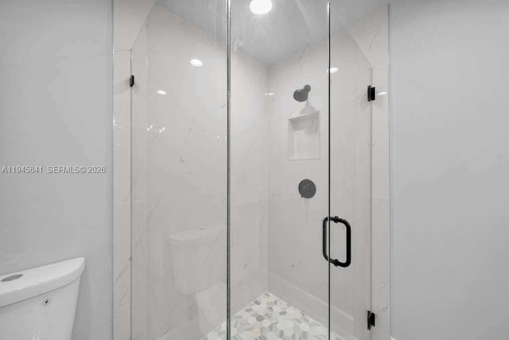 3210 10th Street Southwest, Unit 3210 Lehigh Acres, FL 33976 - Photo 18 of 29 a bathroom with a shower