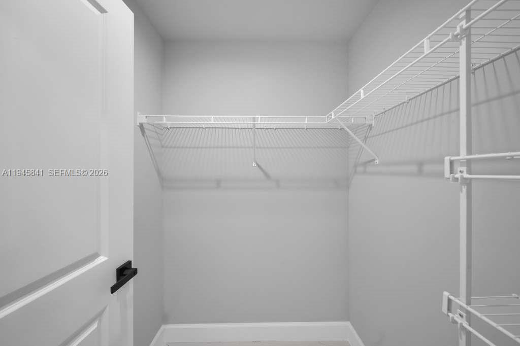 3210 10th Street Southwest, Unit 3210 Lehigh Acres, FL 33976 - Photo 20 of 29 a view of small space with racks on the wall