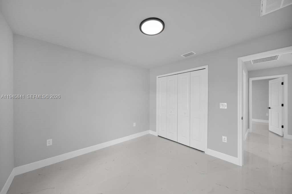 3210 10th Street Southwest, Unit 3210 Lehigh Acres, FL 33976 - Photo 22 of 29 a view of an empty room