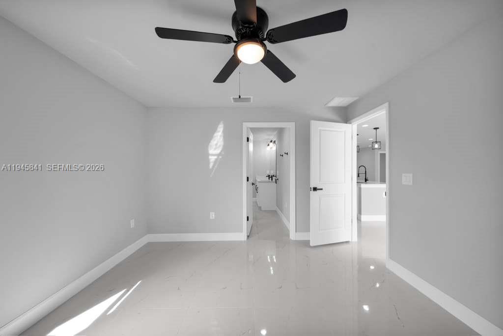 3210 10th Street Southwest, Unit 3210 Lehigh Acres, FL 33976 - Photo 27 of 29 wooden floor in an empty room