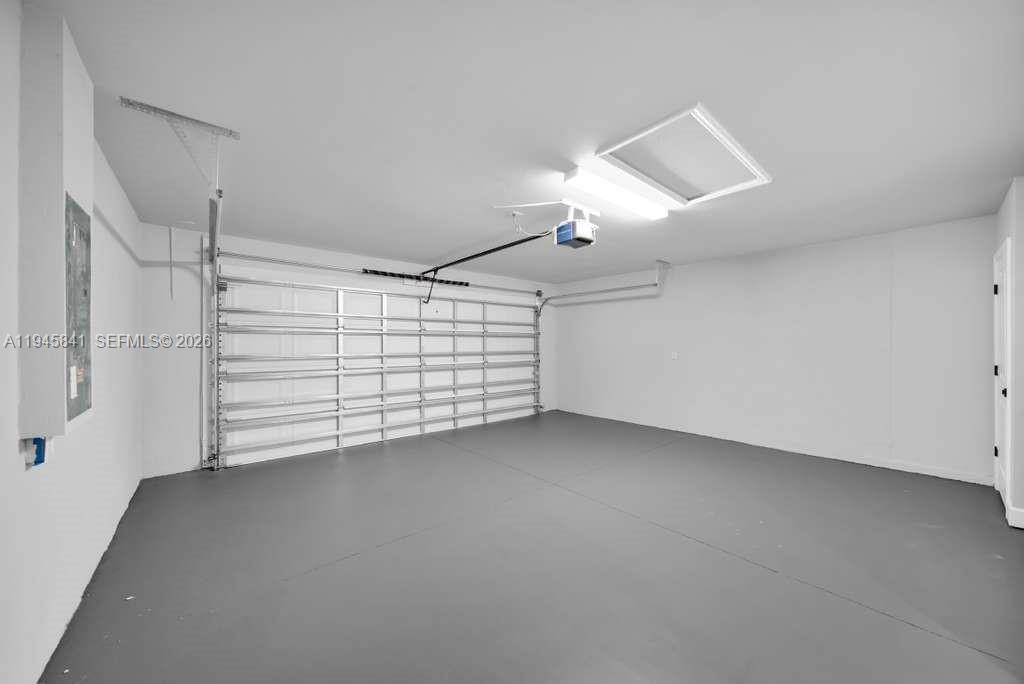 3210 10th Street Southwest, Unit 3210 Lehigh Acres, FL 33976 - Photo 28 of 29 a view of room that has a ceiling fan and window