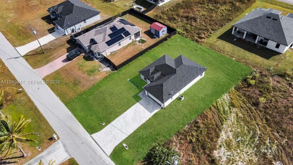 3210 10th Street Southwest, Unit 3210 Lehigh Acres, FL 33976 - Photo 4 of 29 an aerial view of a house