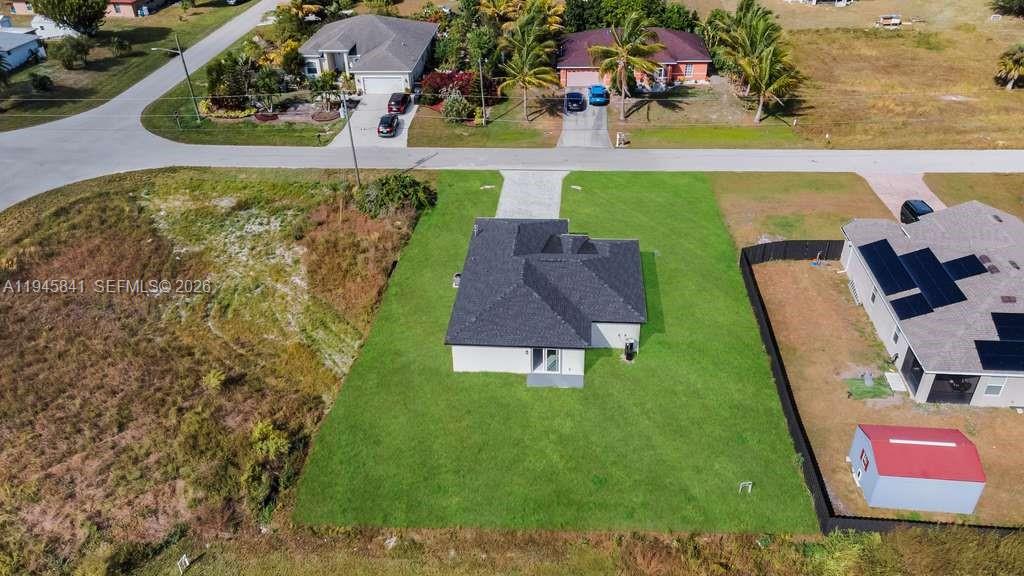 3210 10th Street Southwest, Unit 3210 Lehigh Acres, FL 33976 - Photo 5 of 29 an aerial view of a house with outdoor space