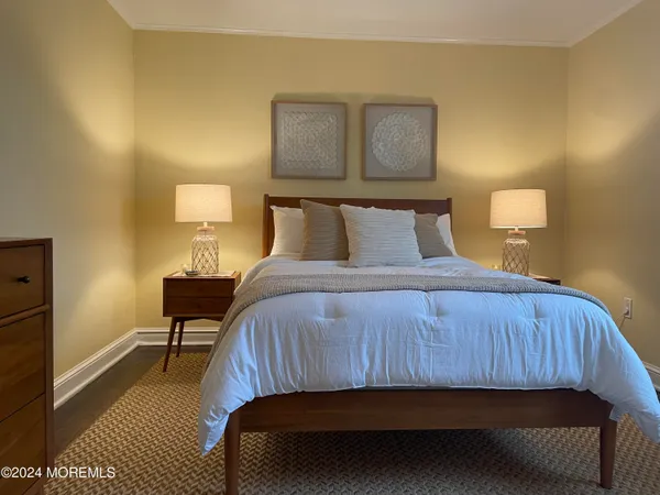 a bedroom with a bed and chair