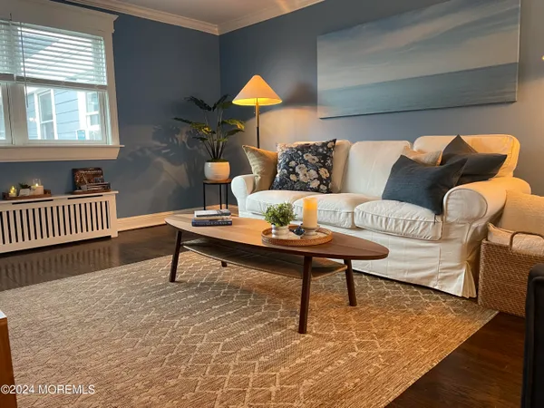 a living room with furniture and a rug