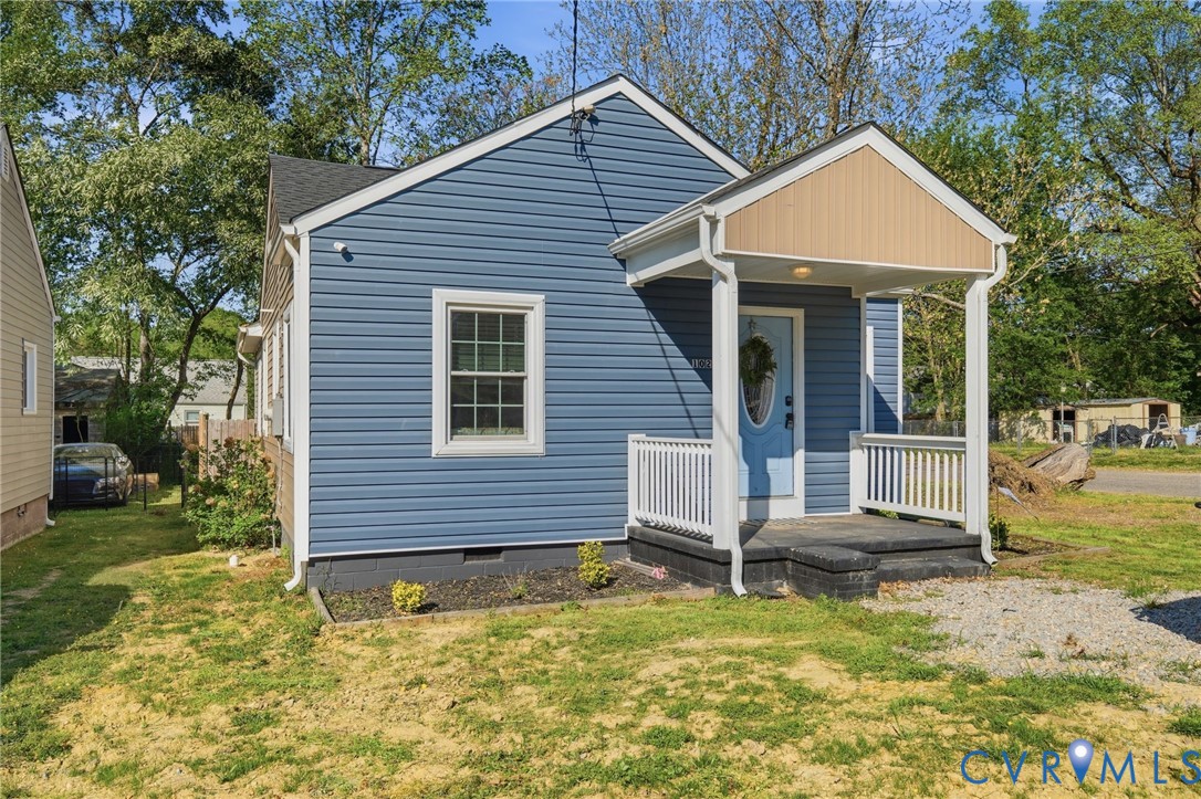 102 Spring Street Petersburg, VA 23803 - Photo 1 of 24 View of front facade featuring a front yard, crawl