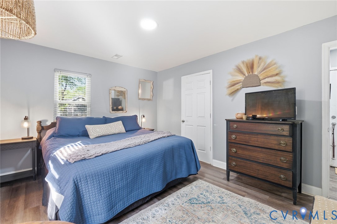 102 Spring Street Petersburg, VA 23803 - Photo 10 of 24 Bedroom featuring dark wood-style floors and baseb