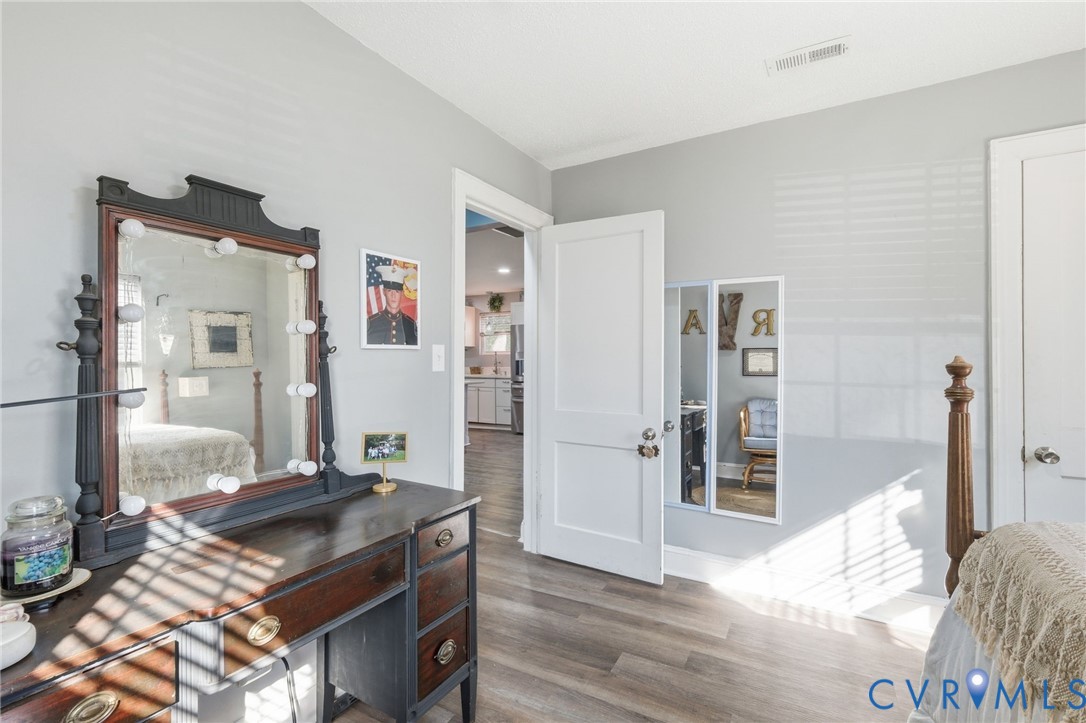 102 Spring Street Petersburg, VA 23803 - Photo 13 of 24 Bedroom featuring wood finished floors and baseboa