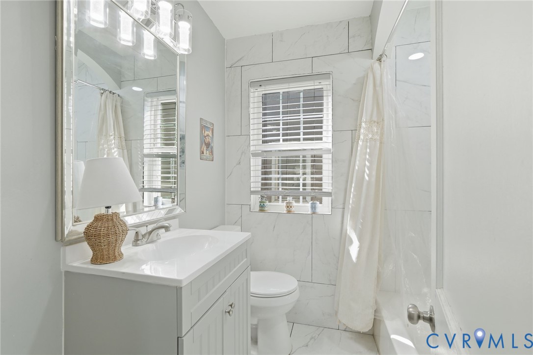 102 Spring Street Petersburg, VA 23803 - Photo 18 of 24 Bathroom with vanity, shower / tub combo with curt