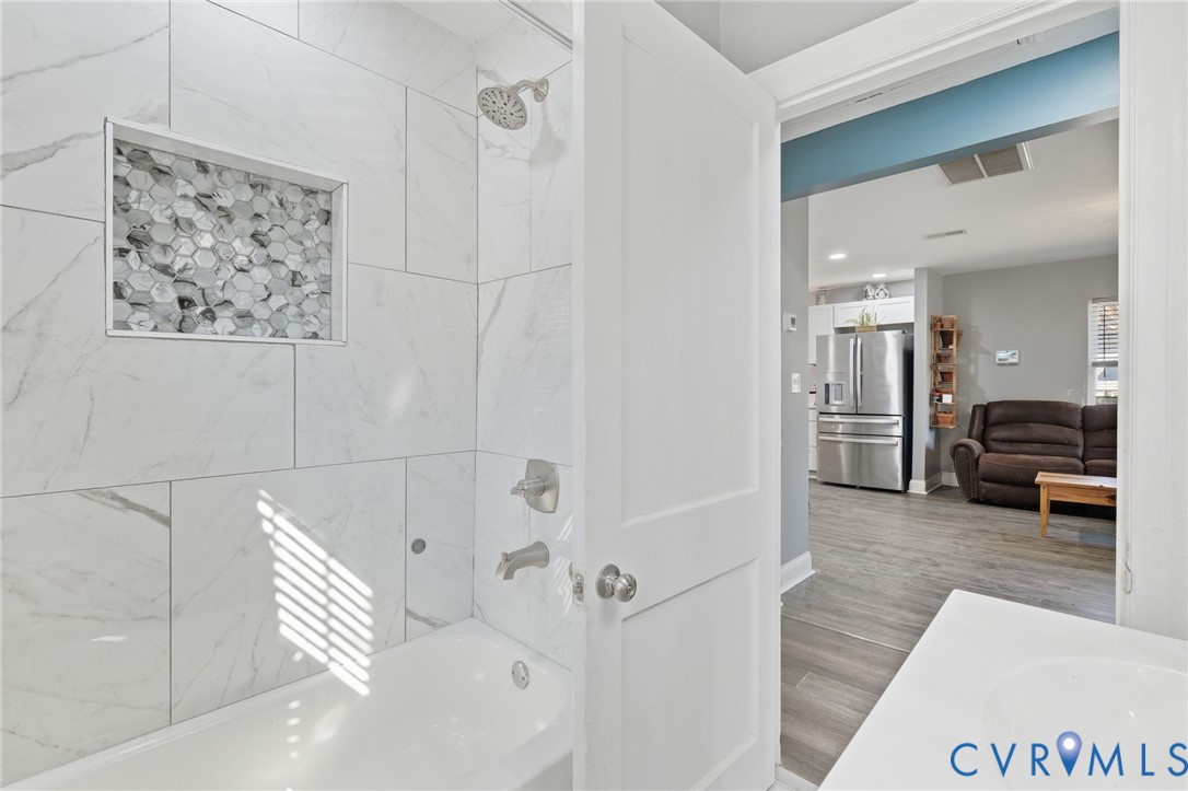 102 Spring Street Petersburg, VA 23803 - Photo 19 of 24 Bathroom with vanity, washtub / shower combination