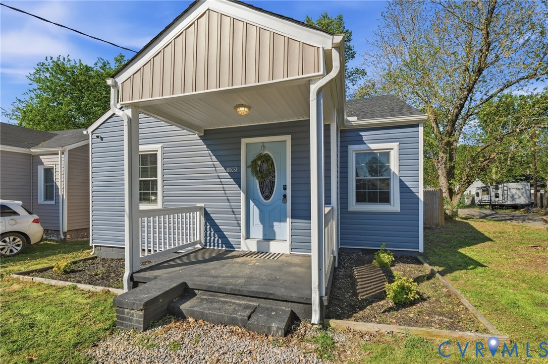 102 Spring Street Petersburg, VA 23803 - Photo 2 of 24 Bungalow-style house featuring a front yard and a