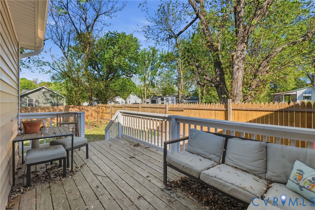 102 Spring Street Petersburg, VA 23803 - Photo 20 of 24 Wooden deck with a fenced backyard