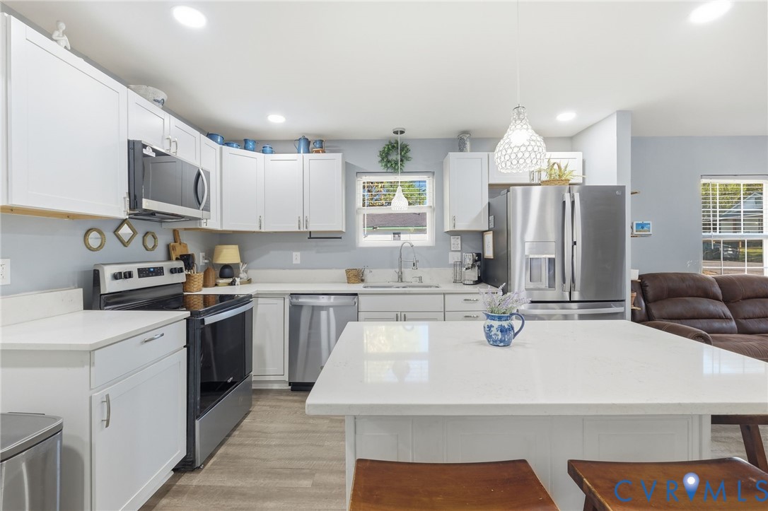 102 Spring Street Petersburg, VA 23803 - Photo 5 of 24 Kitchen with stainless steel appliances, white cab