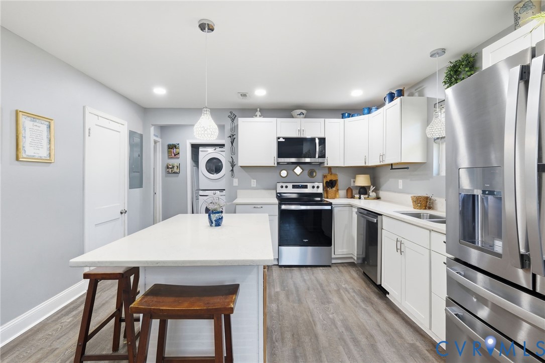 102 Spring Street Petersburg, VA 23803 - Photo 6 of 24 Kitchen with stainless steel appliances, white cab