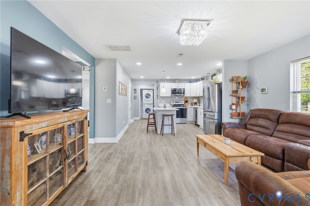 102 Spring Street Petersburg, VA 23803 - Photo 7 of 24 Living area featuring stacked washing machine and