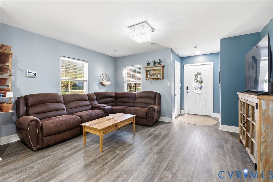 102 Spring Street Petersburg, VA 23803 - Photo 9 of 24 Living room featuring wood finished floors and bas