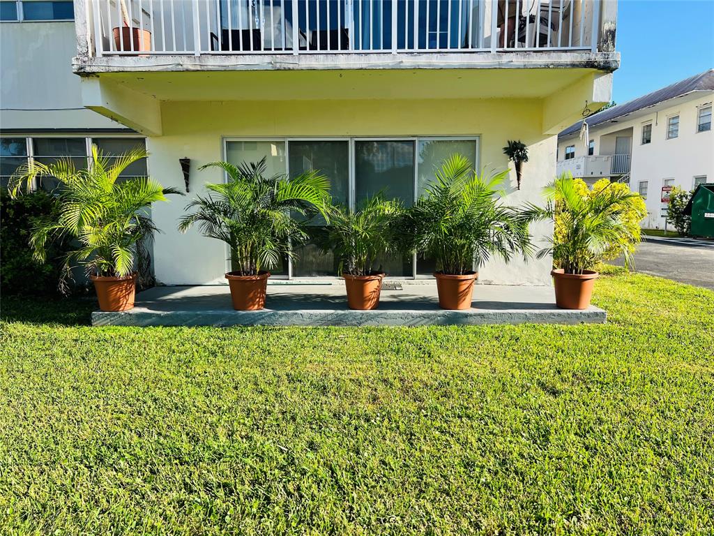 7320 Southwest 82nd Street Miami, FL 33143 - Photo 2 of 8 a front view of a house with a yard