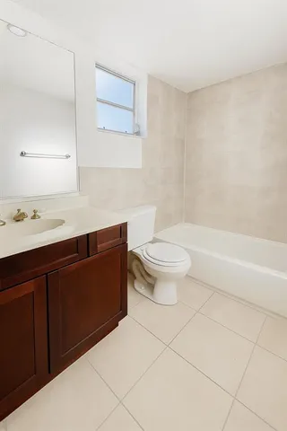 a bathroom with a sink a toilet and a bathtub