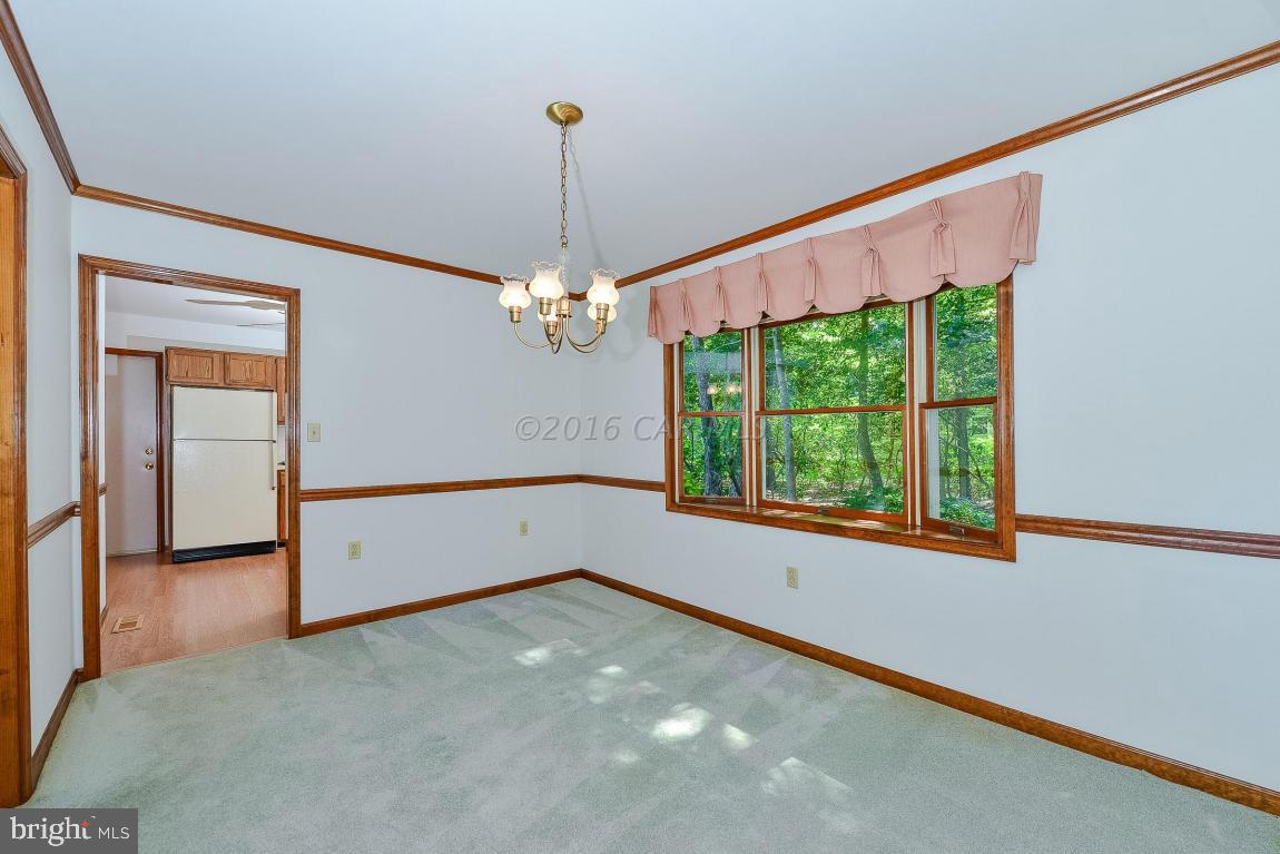 241 Windjammer Road Berlin, MD 21811 - Photo 10 of 38 a view of an empty room with a window